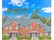 A well-maintained brick townhouse with a landscaped front and visible parking at 914 Hillside Dr. S # O, North Myrtle Beach, SC 29582