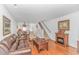 Inviting living room featuring an open layout, hardwood floors, and a staircase leading to the upper level at 914 Hillside Dr. S # O, North Myrtle Beach, SC 29582