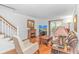 Bright living room showcasing hardwood floors, a fireplace, and sliding glass doors that open to outdoor space at 914 Hillside Dr. S # O, North Myrtle Beach, SC 29582