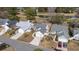 Overhead view of well-maintained homes, landscaped yards, and a community golf course with a scenic pond at 9430 Pinckney Ln., Murrells Inlet, SC 29576