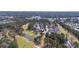 Aerial view of the community highlighting the property's location near the golf course, ponds and neighborhood at 9430 Pinckney Ln., Murrells Inlet, SC 29576