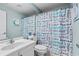 This bathroom features a stand alone vanity and a toilet with a 'bubbles' shower curtain at 9430 Pinckney Ln., Murrells Inlet, SC 29576
