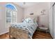 Bright bedroom features a large window, wood-look flooring, and a charming coastal-themed decor at 9430 Pinckney Ln., Murrells Inlet, SC 29576