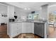 Bright kitchen with granite countertops and stainless steel dishwasher at 9430 Pinckney Ln., Murrells Inlet, SC 29576