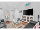 Open living area with a vaulted ceiling, a modern TV, and views of the front entrance at 9430 Pinckney Ln., Murrells Inlet, SC 29576