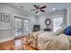 Bedroom with hardwood floors, ceiling fan, and French doors to the outside at 1006 Clubhouse Dr., North Myrtle Beach, SC 29582