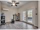 Versatile bonus room with wood-look flooring, exercise equipment, and glass doors to outside at 1006 Clubhouse Dr., North Myrtle Beach, SC 29582