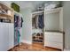 Organized walk-in closet with built-in shelving and wooden floor at 1006 Clubhouse Dr., North Myrtle Beach, SC 29582