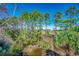 View of trees and foliage with a building visible in the background at 1006 Clubhouse Dr., North Myrtle Beach, SC 29582