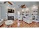 Comfortable living room features a fireplace, built-in shelving, and two ceiling fans at 1006 Clubhouse Dr., North Myrtle Beach, SC 29582