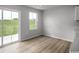 Bright dining area features wood floors, a large window, and a sliding glass door with a view of the backyard at 1079 Oak Meadow Dr., Conway, SC 29526