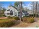 Charming gray two-story townhome exterior featuring mature landscaping, a private balcony, and driveway at 1205 Erin Way # 5C, Myrtle Beach, SC 29577