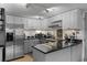 Well-lit kitchen featuring stainless steel appliances, granite countertops, and ample cabinet space at 1205 Erin Way # 5C, Myrtle Beach, SC 29577