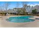 Community pool is surrounded by lush greenery and offers a gazebo with seating at 1205 Erin Way # 5C, Myrtle Beach, SC 29577