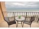 Inviting balcony with patio furniture and stunning ocean views at 1501 S Ocean Blvd. # 504, North Myrtle Beach, SC 29582