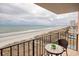 Relaxing balcony with table and ocean view at 1501 S Ocean Blvd. # 504, North Myrtle Beach, SC 29582