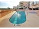 Outdoor pool area has lounge chairs and a privacy wall, perfect for relaxation at 1501 S Ocean Blvd. # 504, North Myrtle Beach, SC 29582