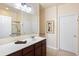 Well-lit bathroom with a dark wood vanity, ample counter space, and a framed picture on the wall at 1517 Palmina Loop # B, Myrtle Beach, SC 29588