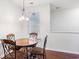 Cozy dining area featuring a chandelier and a view of the outdoor greenery at 1517 Palmina Loop # B, Myrtle Beach, SC 29588