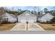 Charming home featuring a two-car garage, well-manicured lawn, and welcoming curb appeal at 1517 Palmina Loop # B, Myrtle Beach, SC 29588