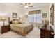 Main bedroom with carpet and queen bed with side tables and window at 1517 Palmina Loop # B, Myrtle Beach, SC 29588