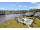 Aerial view of waterfront property, pool, and dock showcasing its prime location at 1537 Lanterns Rest Rd. # 202, Myrtle Beach, SC 29579