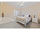 Comfortable guest bedroom features warm carpet flooring, natural light, and a soft, relaxing aesthetic at 1537 Lanterns Rest Rd. # 202, Myrtle Beach, SC 29579