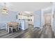 This kitchen features white cabinets and appliances, which opens up into a large dining area at 1537 Lanterns Rest Rd. # 202, Myrtle Beach, SC 29579