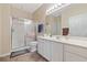 Bright main bathroom with a walk-in shower, white cabinets, and a neutral color palette at 1537 Lanterns Rest Rd. # 202, Myrtle Beach, SC 29579