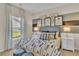 Comfortable bedroom with natural light, stylish bedding, and curated decor at 1609 Seachase Way, North Myrtle Beach, SC 29582