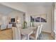 Cozy dining area seamlessly connects to the living room, offering a modern aesthetic and comfortable setting at 1609 Seachase Way, North Myrtle Beach, SC 29582