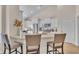 Modern kitchen with granite countertops, stylish bar stools, and stainless steel appliances with white cabinetry at 1609 Seachase Way, North Myrtle Beach, SC 29582