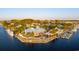 Aerial view of restaurant on a waterway, with docks, outdoor seating, and palm tree landscaping at 1613 Seachase Way, North Myrtle Beach, SC 29582