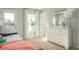 Bedroom featuring a white dresser, soft carpet, and natural light from multiple windows at 1613 Seachase Way, North Myrtle Beach, SC 29582