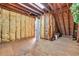 Unfinished attic space with exposed insulation, plywood flooring, and potential for customization at 1616 Hawthorn Dr., Pawleys Island, SC 29585