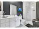 Bright bathroom with a white vanity, framed mirror, and tiled shower with glass door at 1616 Hawthorn Dr., Pawleys Island, SC 29585