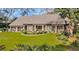 Charming brick home featuring well-manicured lawn, meticulous landscaping, and a welcoming entrance with stylish decor at 1616 Hawthorn Dr., Pawleys Island, SC 29585