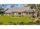 Charming brick home featuring a well-manicured lawn, decorative shrubbery, and a welcoming front entrance at 1616 Hawthorn Dr., Pawleys Island, SC 29585