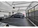 Well-organized two-car garage featuring a modern vehicle, organized storage, and durable rubber flooring at 1616 Hawthorn Dr., Pawleys Island, SC 29585
