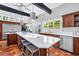 Spacious kitchen with a large island, seating, stainless steel appliances, and a double sink at 1616 Hawthorn Dr., Pawleys Island, SC 29585