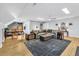Large living room with ample seating, hardwood floors, and recessed lighting at 1616 Hawthorn Dr., Pawleys Island, SC 29585
