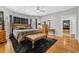Large main bedroom featuring hardwood floors, a sitting area, and bright windows at 1616 Hawthorn Dr., Pawleys Island, SC 29585