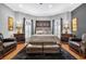 Bedroom featuring natural light, wood floors, a sitting area, and decorative lamps at 1616 Hawthorn Dr., Pawleys Island, SC 29585