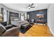 Relaxing main bedroom featuring hardwood floors, a ceiling fan, and a stylish accent wall at 1616 Hawthorn Dr., Pawleys Island, SC 29585