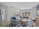 Bright living room featuring natural light and open floor plan leading into the kitchen at 1705 Seachase Way, North Myrtle Beach, SC 29582