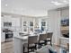 Well-lit kitchen with a center island, plank floors, stainless steel appliances, and a view to the backyard at 1713 Seachase Way, North Myrtle Beach, SC 29582