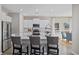 Bright kitchen featuring white cabinets, granite counters, stainless steel appliances, and plank flooring at 1713 Seachase Way, North Myrtle Beach, SC 29582