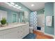 Bright bathroom with a double sink vanity, framed mirror, shower and tub at 177 Reef Run Rd., Pawleys Island, SC 29585