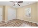 Bedroom featuring wood-look floors, closet, and a window that provides plenty of natural light at 177 Reef Run Rd., Pawleys Island, SC 29585