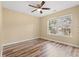 Bedroom featuring wood floor, neutral walls, large window, and ceiling fan at 177 Reef Run Rd., Pawleys Island, SC 29585